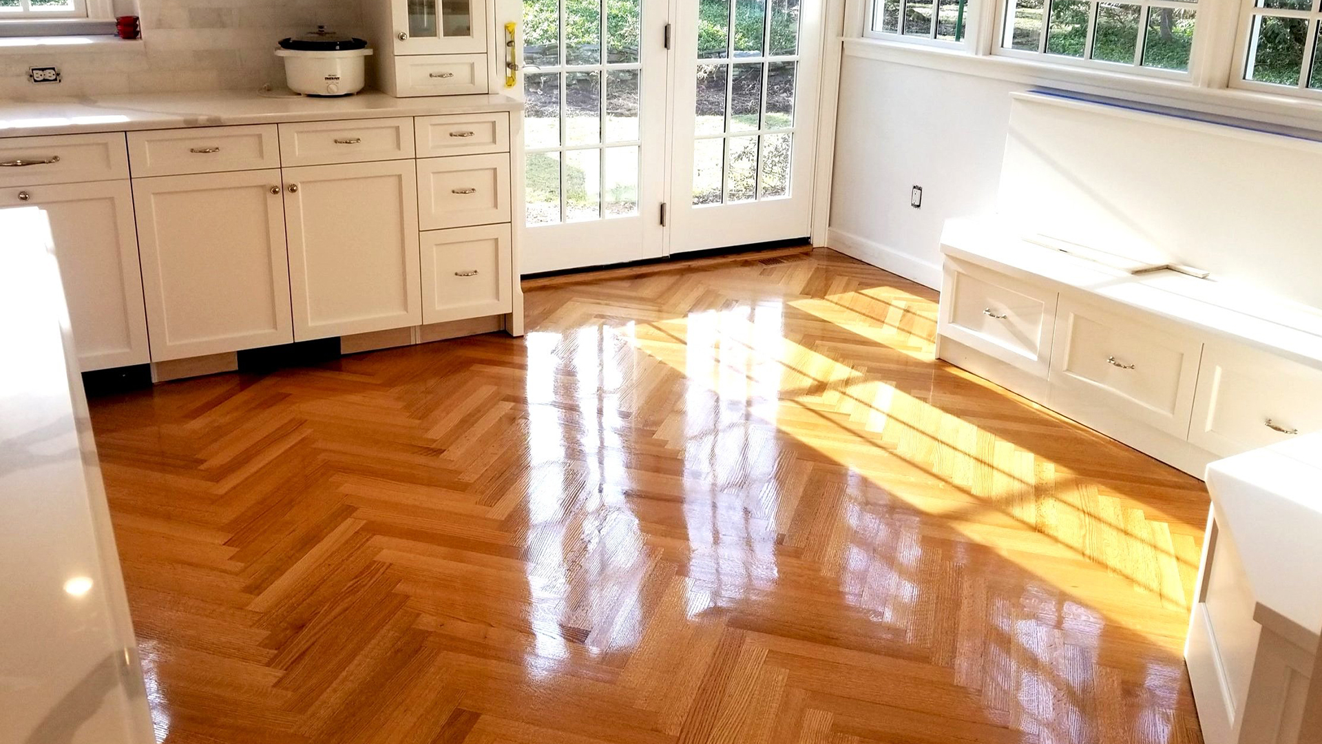 Photo of a floor refinished by JAK in natural tones