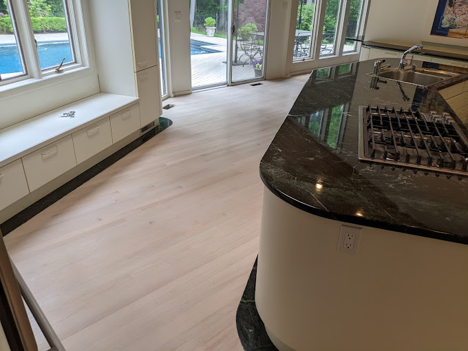 Photo of a kitchen wood floor in natural tones