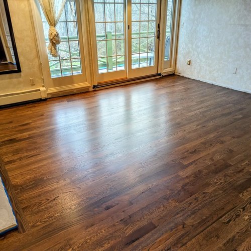 Image of medium brown refinished hard wood floors