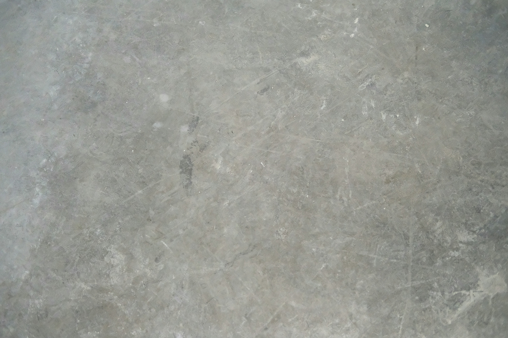 Photo of a gray concrete floor.