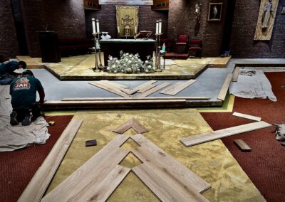 Hardwood floor layout planning at the altar platform, showing plank flow and diamond alignment