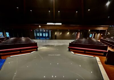 Freshly poured self-leveling compound in church sanctuary