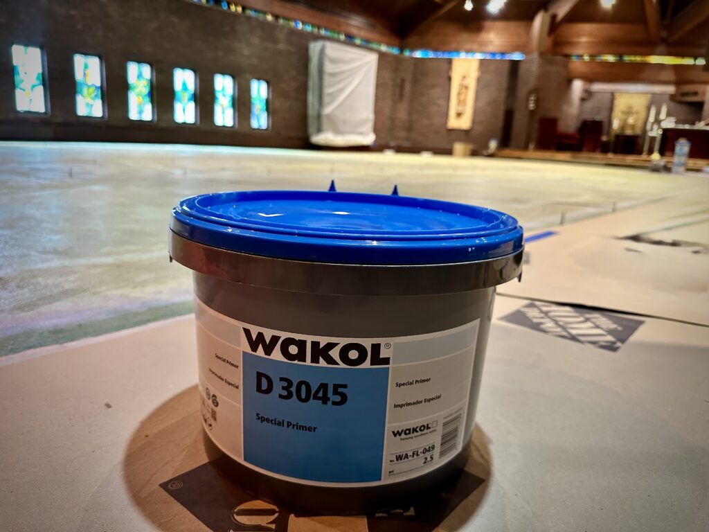 Wakol D 3045 special primer used over moisture barrier in church sanctuary