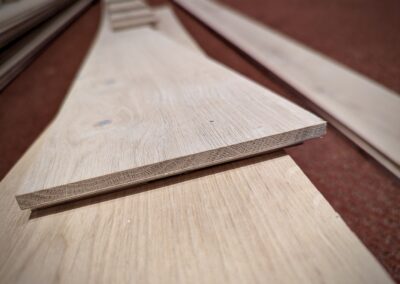 Close-up of custom-milled stair risers fabricated from European white oak flooring at Saint Thomas More Church